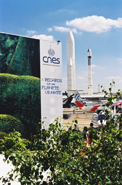2 Ariane launcher models next to the CNES pavilion ; credits CNES