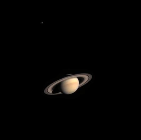 Saturn and the satellite Titan, top left. Credits: ESA/NASA/ASI. 