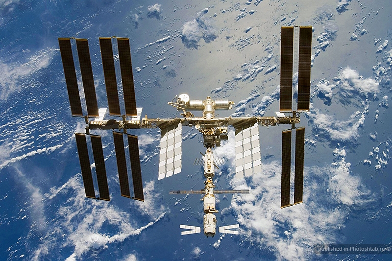 The ATV docked to the International Space Station (module at bottom of picture). Credits: NASA.