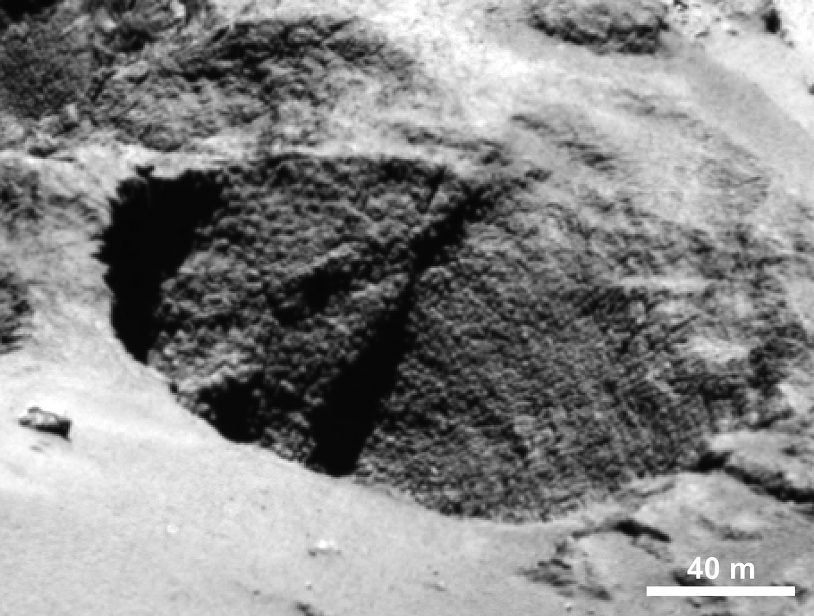 Formation en « œufs de dinosaures » ou en « cou de dinde » sur la paroi d’un puits. Crédits : ESA/Rosetta/MPS for OSIRIS Team MPS/UPD/LAM/IAA/SSO/INTA/UPM/DASP/IDA. 